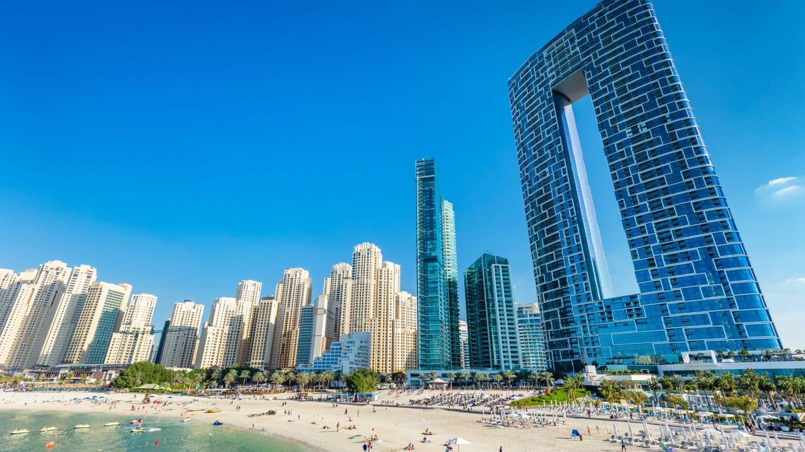 JBR Beach filled with tourists and the iconic Address JBR Resort