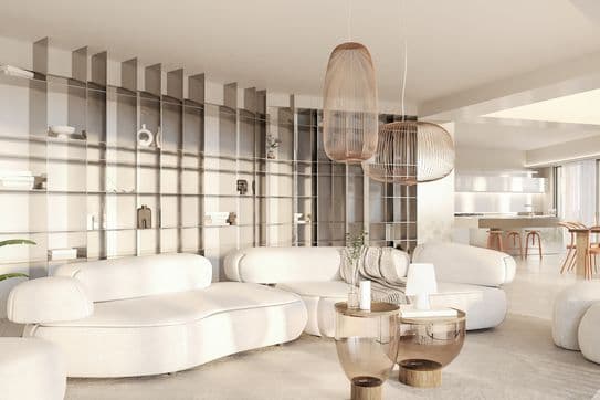 Bright modern living room with curved white sofas, glass-topped round side tables, wire pendant lamps and open shelving.