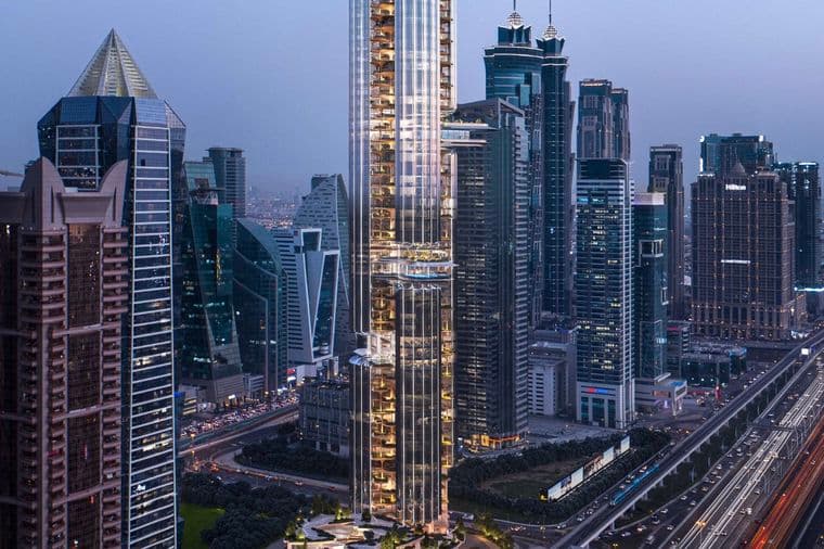 A tall, modern skyscraper in an urban skyline at dusk, surrounded by other high-rise buildings and busy highways with streaking car lights.