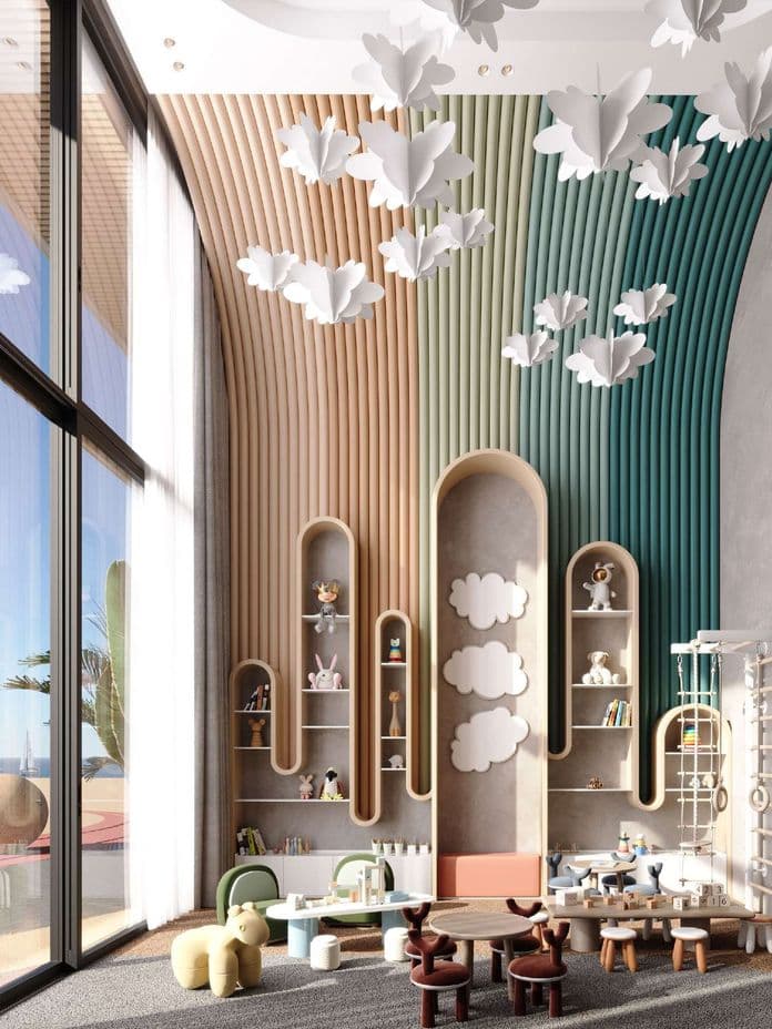 Whimsical children's playroom with colorful wall design, cloud decor, plush toys, and various play stations under soft natural light from large windows.