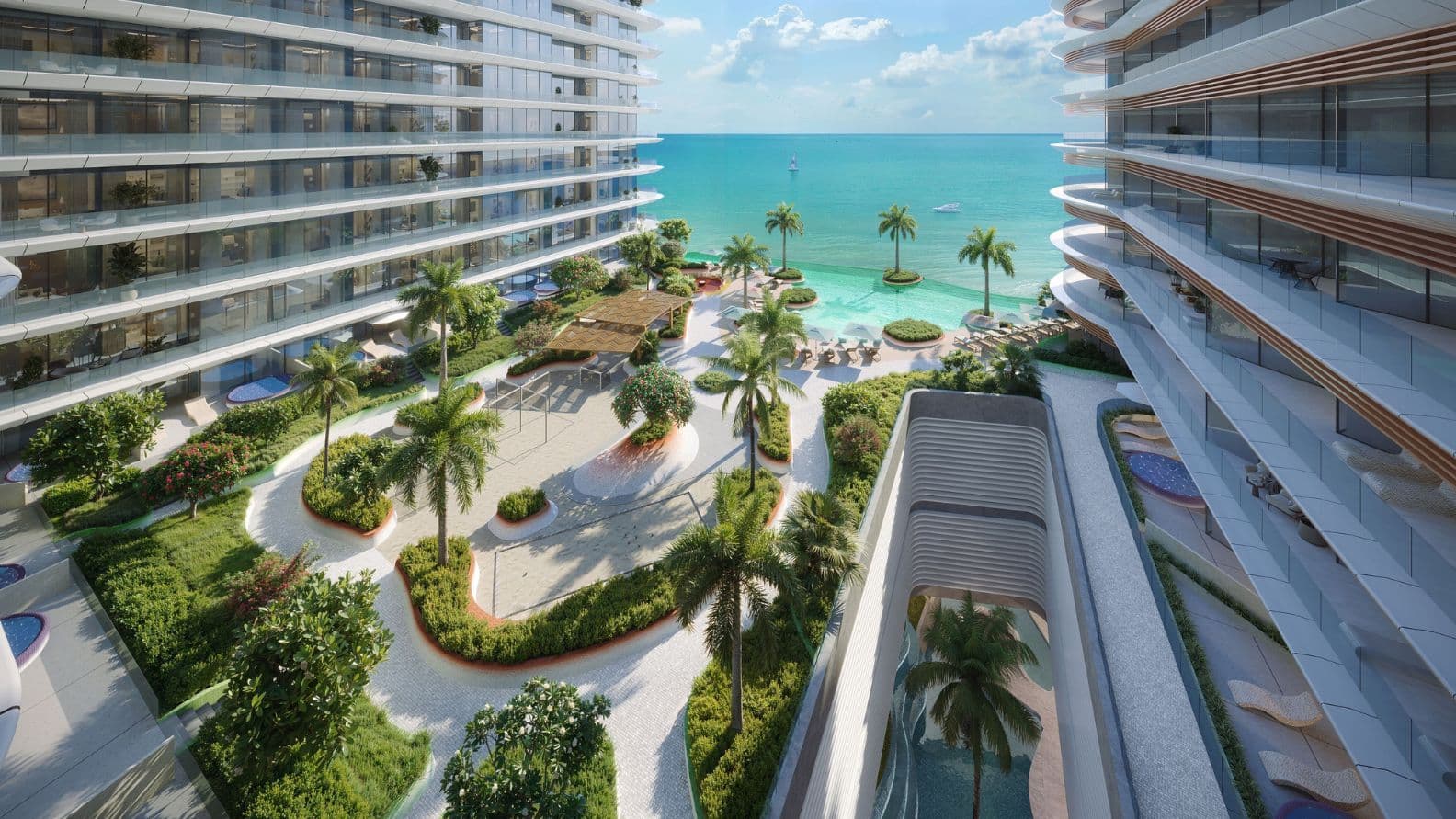 Gardens, infinity pool and sea view from Trio Isle Residence apartment