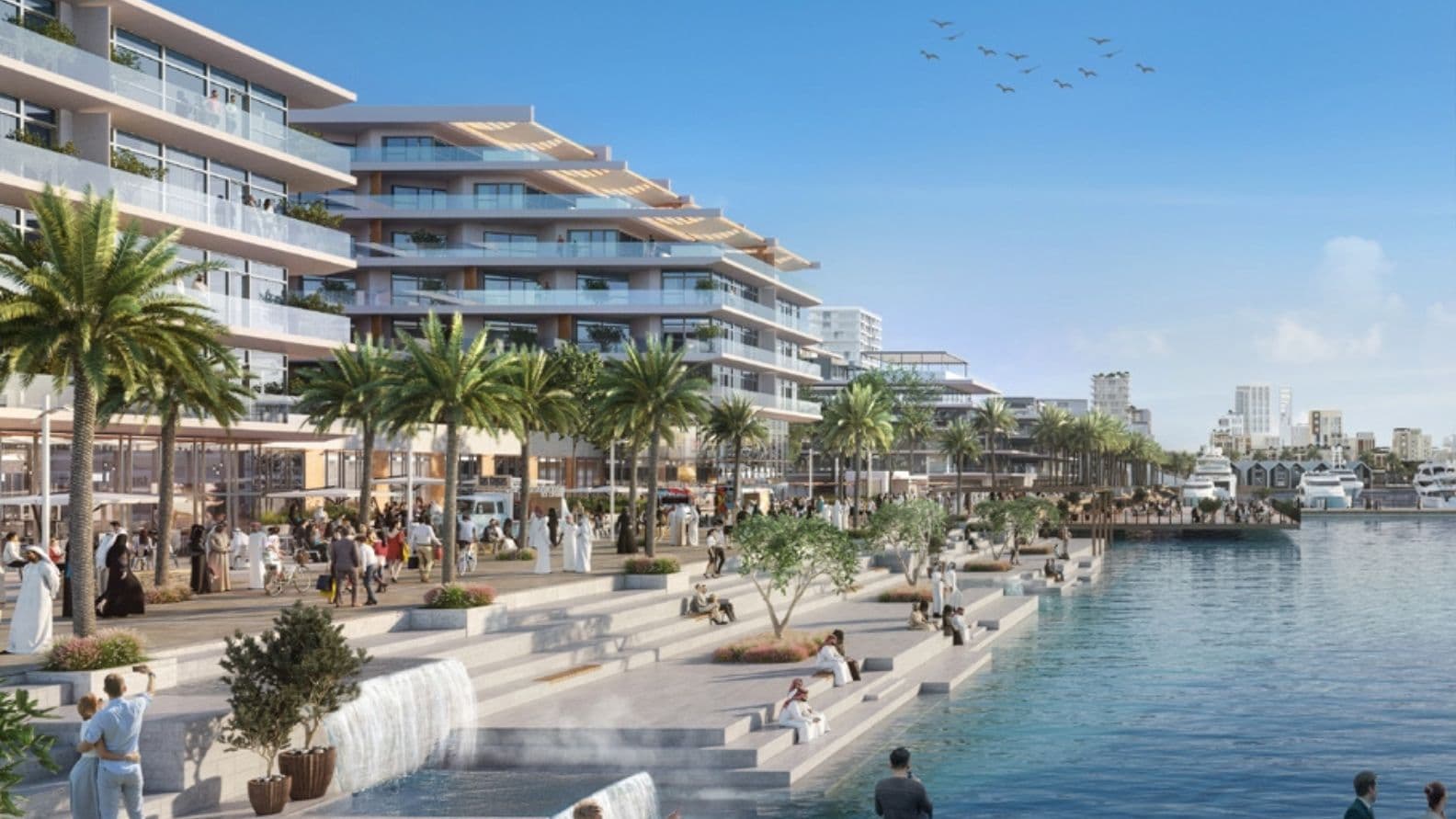 Lively waterfront promenade at Mina Rashid, featuring modern low-rise residences with large balconies, palm trees, cascading water features, outdoor dining areas, and people walking, relaxing, and enjoying the marina views under a clear blue sky.          Ask ChatGPT