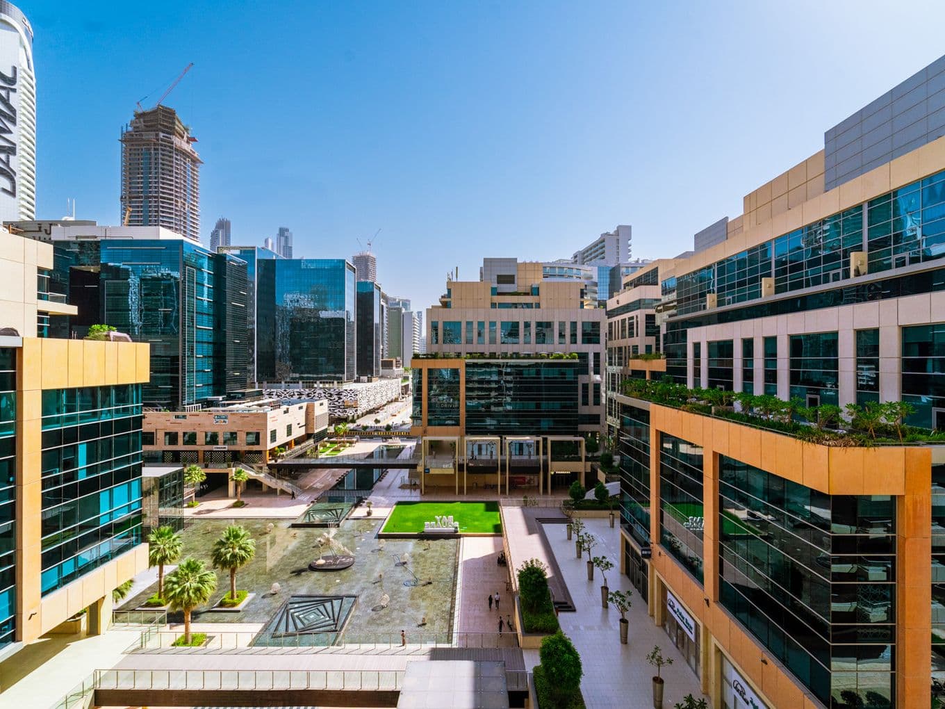 Bay Square building with a daytime view of the central courtyard and fountain
