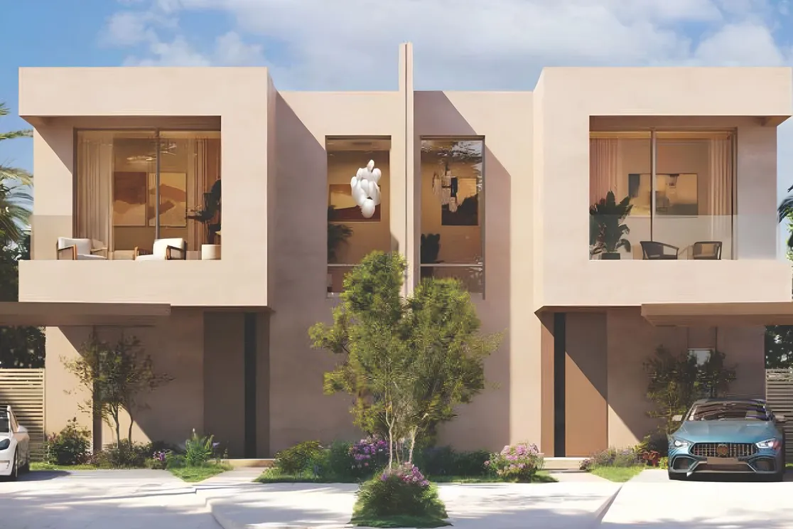 Beige two-story townhouse with large glass balconies, a central sculpture, lush front garden, and a blue car in the driveway. KI-generiertes Bild