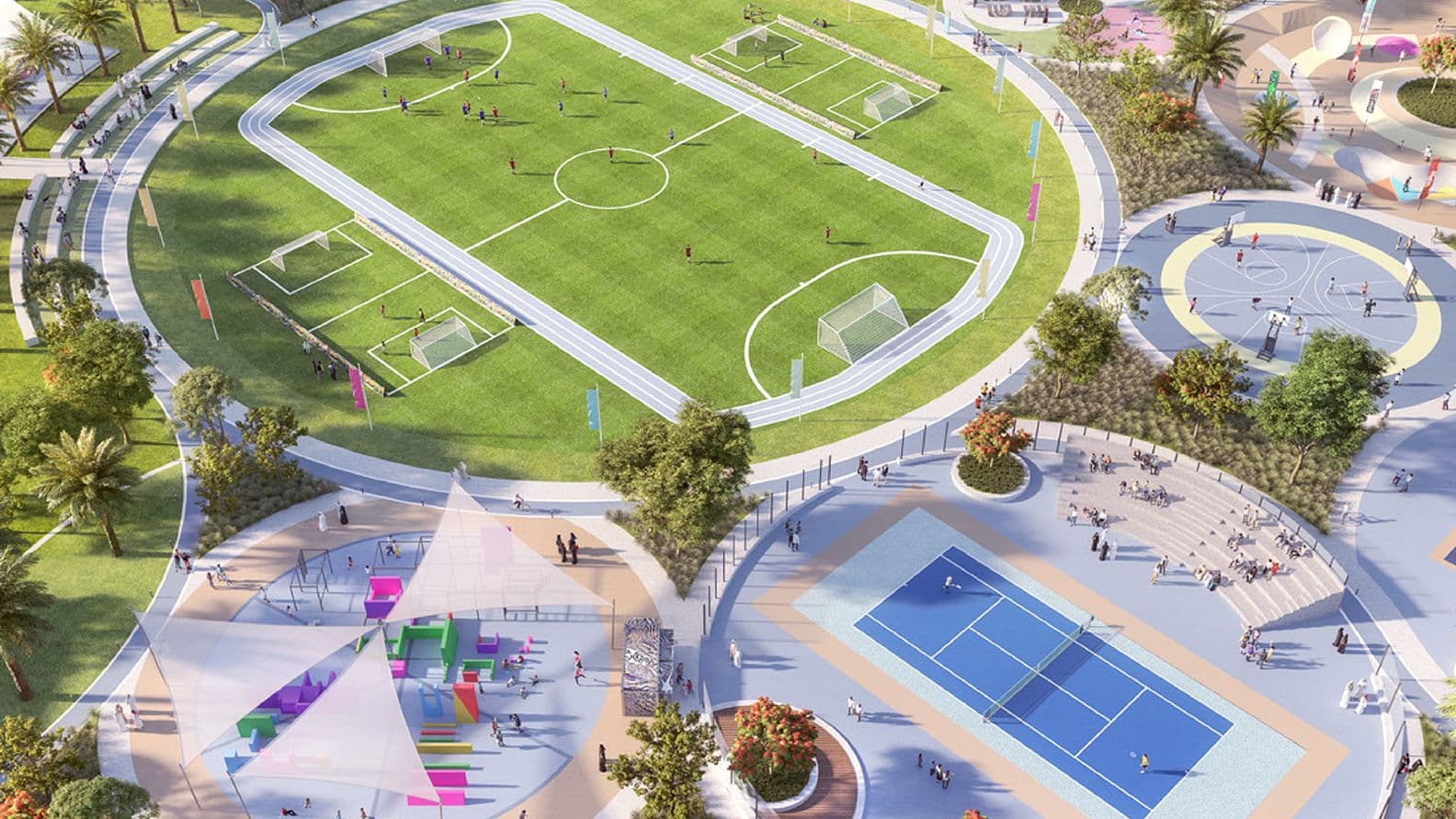 Aerial view of a multi-sport recreational park in The Valley featuring a full-sized football field, basketball and tennis courts, a shaded children’s playground, and landscaped walking paths surrounded by greenery.