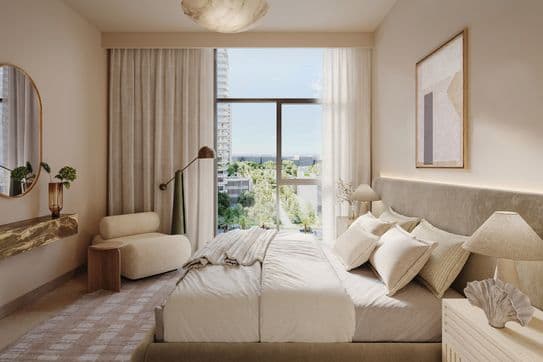 A modern bedroom with a large window, neutral tones, a plush bed, armchair, abstract art, and a view of greenery outside.