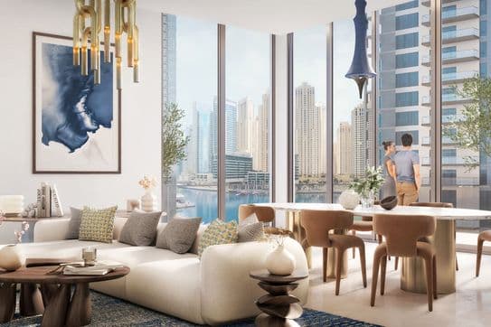 Modern living room with large windows, city skyline view, stylish furniture, abstract art, and two people standing by the window.