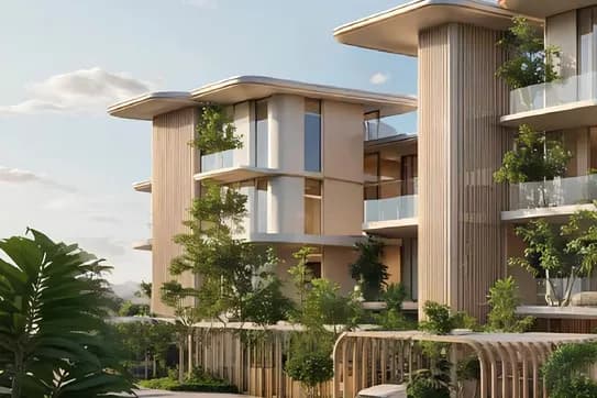 Modern beige apartment complex with curved canopies, vertical slats, glass balconies, lush greenery, and a white car parked beneath. KI-generiertes Bild
