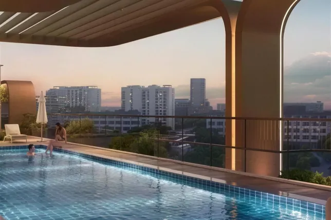 Rooftop pool with blue water under a curved modern canopy; glass railing, sunset city skyline, and people relaxing and swimming.