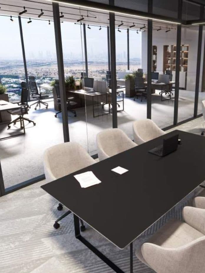 Co-working space and meeting room at Samana Barari Avenue with floor-to-ceiling windows and expansive views of Dubai’s green suburban areas.