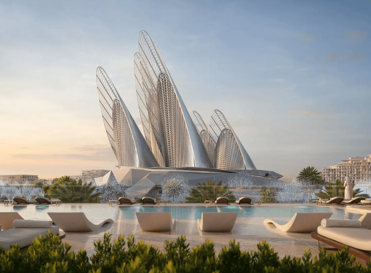 Futuristic building with sail-like structures by a pool, surrounded by modern architecture and palm trees, under a clear sky.