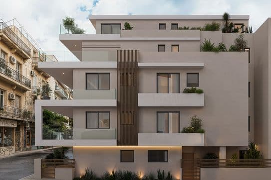 Modern multi-story building with white facade, balconies, and rooftop plants, set against a partly cloudy sky in an urban environment.