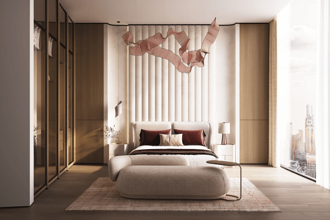 Modern bedroom with a large bed, padded headboard, abstract wall art, and floor-to-ceiling windows offering a city view. Neutral and pink tones.