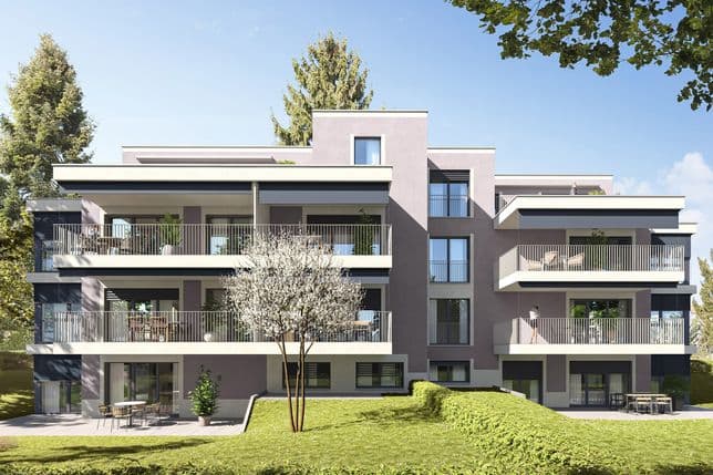 Modern new-build project with various residential units with a garden seating area and surrounded by fir trees