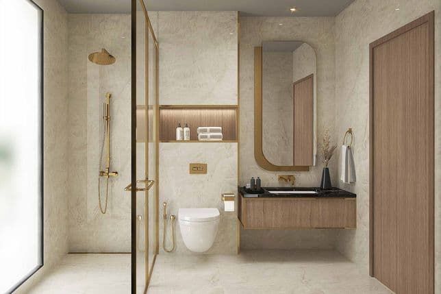Modern bathroom with marble walls, gold accents, glass shower, floating vanity, oval mirror, and toilet. Natural light from a frosted window.