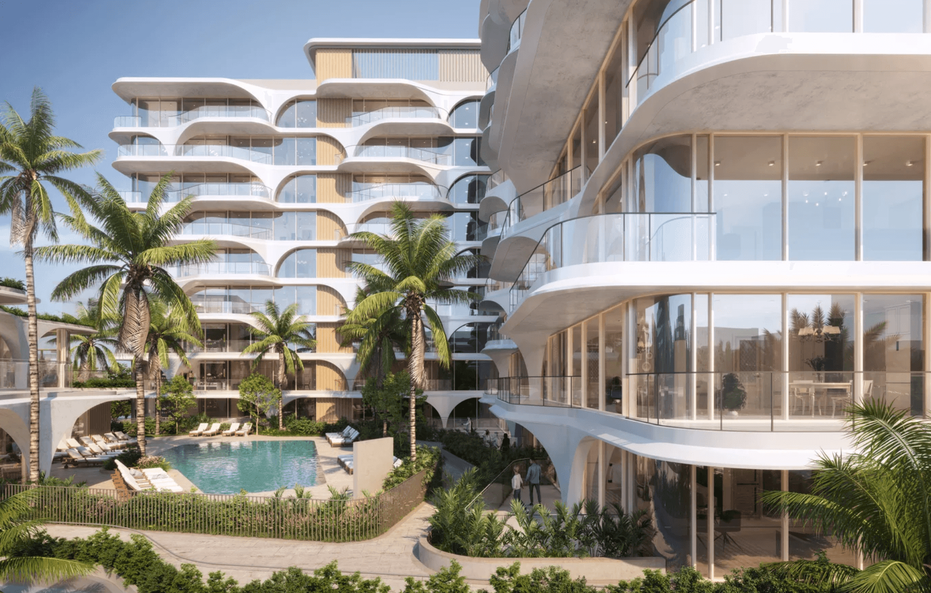 Modern apartment complex with curved balconies, surrounded by palm trees, featuring a central pool area with lounge chairs.