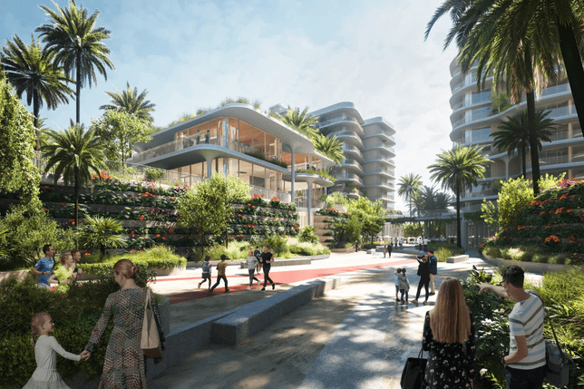 Modern architectural complex with curved buildings, lush greenery, and people walking on a sunlit pathway lined with palm trees.