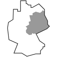 Umrisskarte, die eine Region innerhalb eines größeren Gebiets hervorhebt, in Grau schattiert, die einem Abschnitt eines Landes oder Territoriums ähnelt.