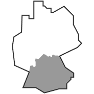 Umrisskarte mit einer hervorgehobenen Region im südlichen Teil, die auf ein spezifisches Gebiet innerhalb einer größeren Grenze hinweist.