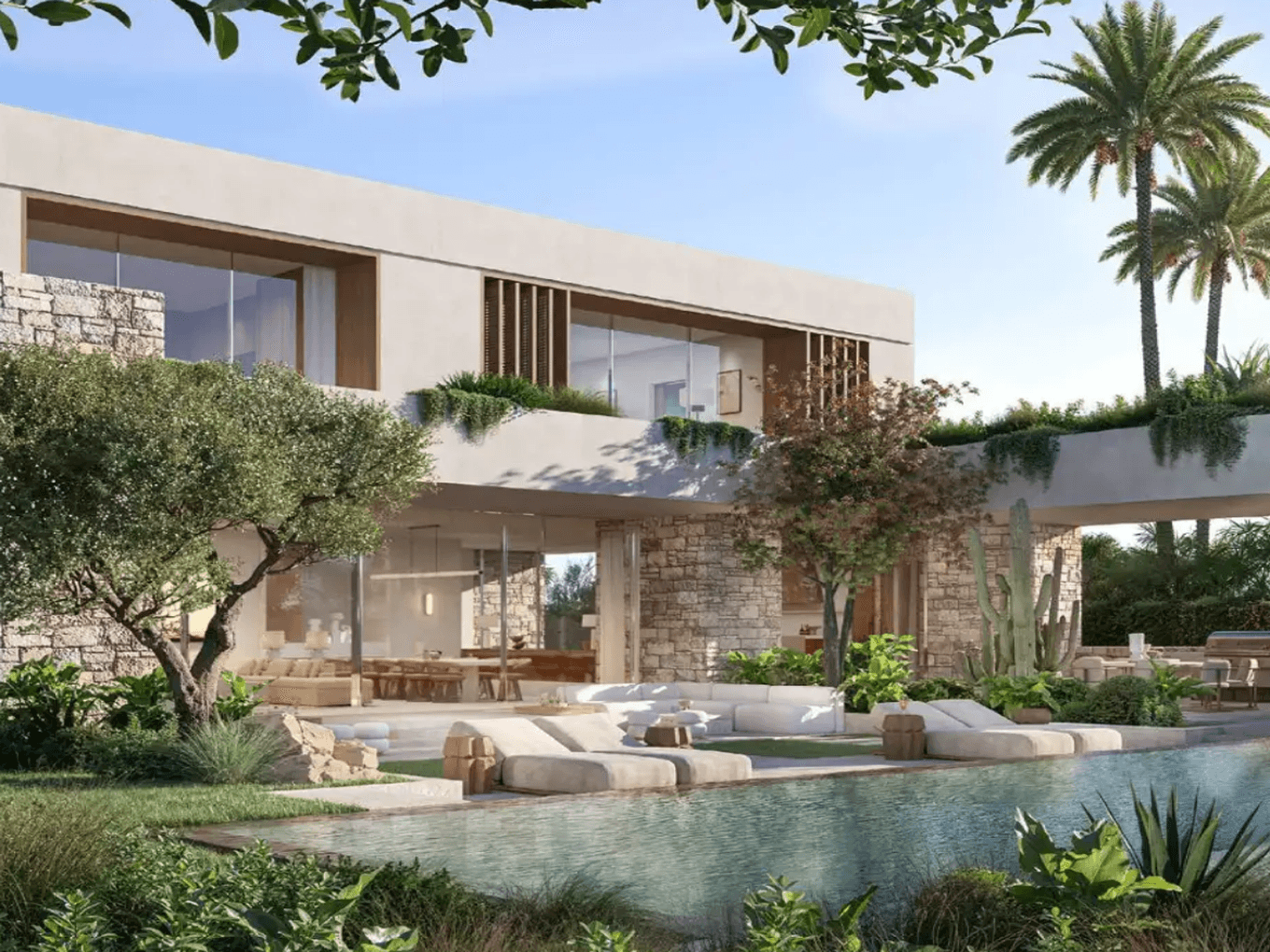 Modern villa with stone and glass facade, surrounded by palm trees and greenery, featuring a pool and outdoor seating area under a clear blue sky.