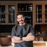 Portrait of famous chef Alexandros Tsiotinis in his restaurant