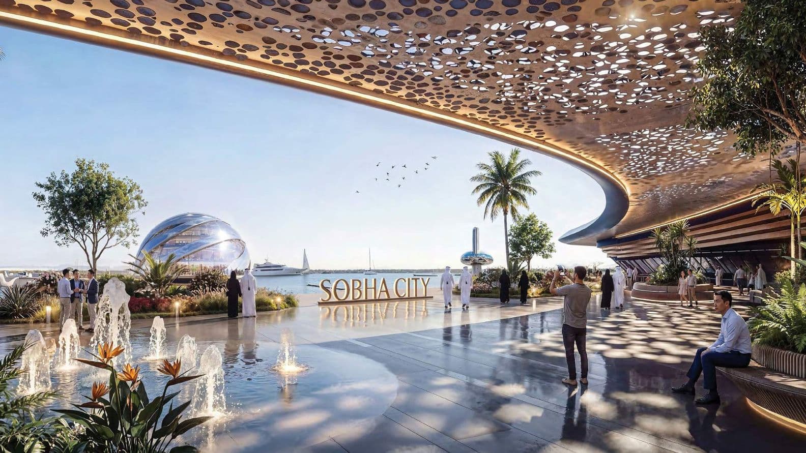 Futuristic waterfront scene at Sobha City with people, modern architecture, fountains, and a view of the sea with yachts and a glass dome.