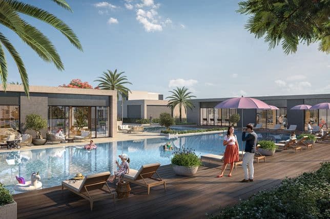 Luxurious poolside scene with people relaxing on loungers, talking, and a unicorn float in the water, surrounded by modern architecture and palm trees.