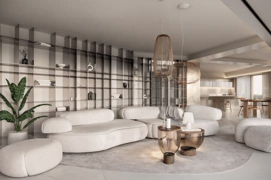 Bright modern living room with curved white sofas, round glass coffee tables, woven pendant lights, wall of shelves and open kitchen.