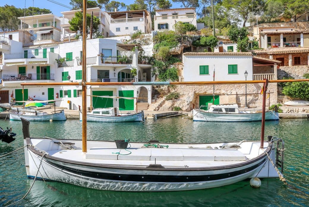 Fishing harbor of Cala Figuera in Mallorca with boats and sailboats in the bay