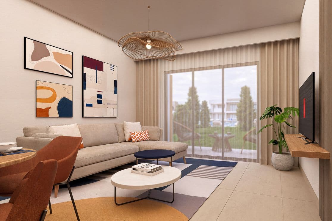 Modern living room with abstract art, beige sofa, round coffee tables, and a large window overlooking a garden. Neutral tones and contemporary decor.