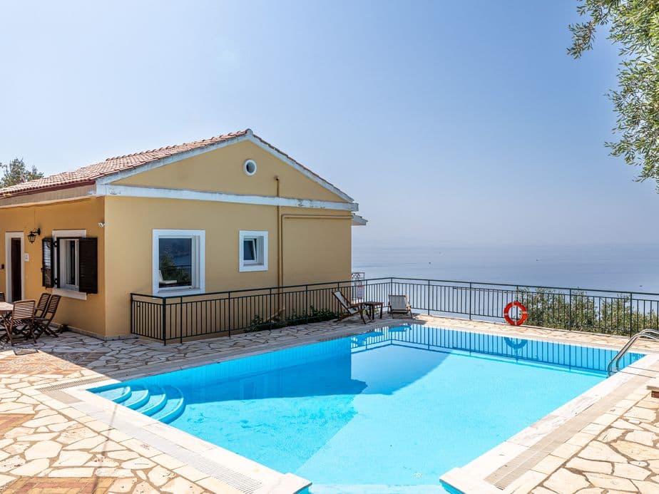 Luxurious villa with swimming pool during day in Corfu, Greece