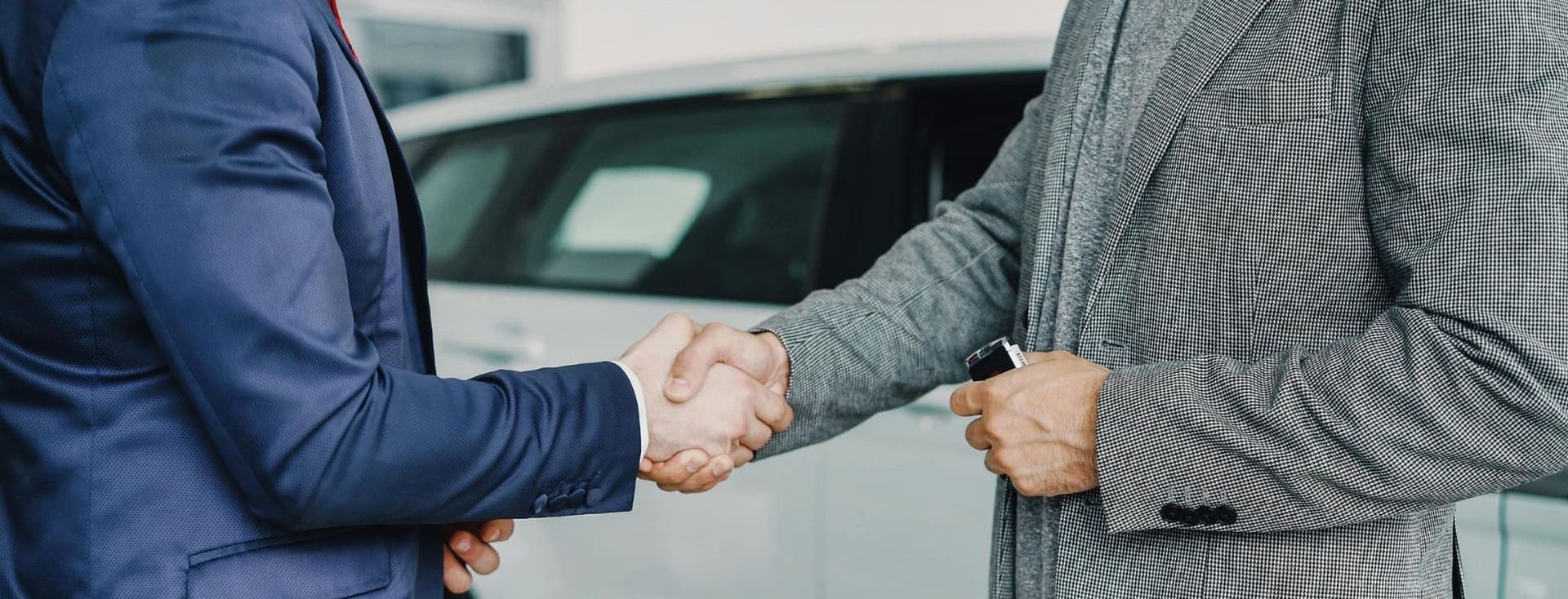 Business professionals shaking hands to finalize a successful agreement in a professional setting