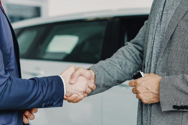 Business professionals shaking hands to finalize a successful agreement in a professional setting