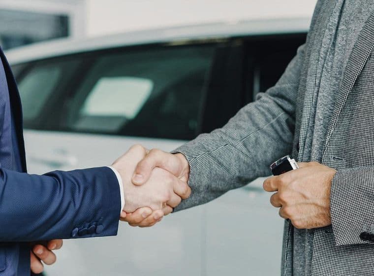 Business professionals shaking hands to finalize a successful agreement in a professional setting
