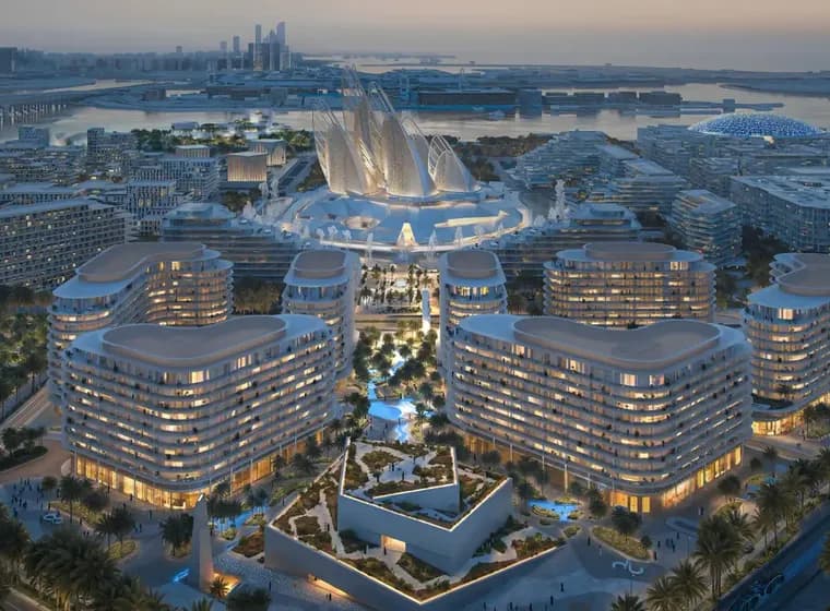Aerial view of a futuristic cityscape at dusk with illuminated, curvy modern buildings, lush greenery, and waterfront in the background.