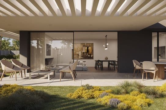 Modern covered patio with wicker chairs and round table, sliding glass doors to living/dining area, landscaped yellow and purple garden.