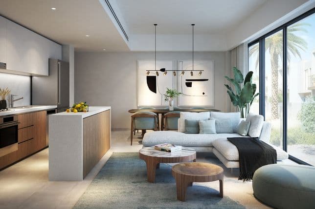 Modern open-plan kitchen and living area with sleek cabinets, large windows, stylish furniture, indoor plants, and minimalist wall art.