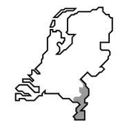 Gray silhouette of a person standing in the dark.