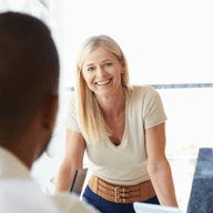 Group of people chatting in a meeting room