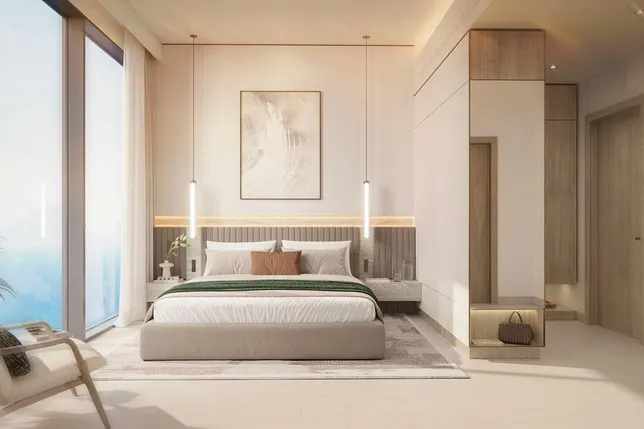 Modern bedroom with large sea-facing windows, neutral decor, upholstered bed, pendant lights, abstract art, and built-in storage. KI-generiertes Bild