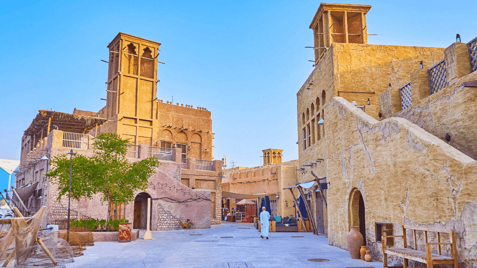 An elegant shot of the restored heritage district, showcasing traditional wind-tower architecture and winding cobblestone alleys that bring Dubai’s past to life