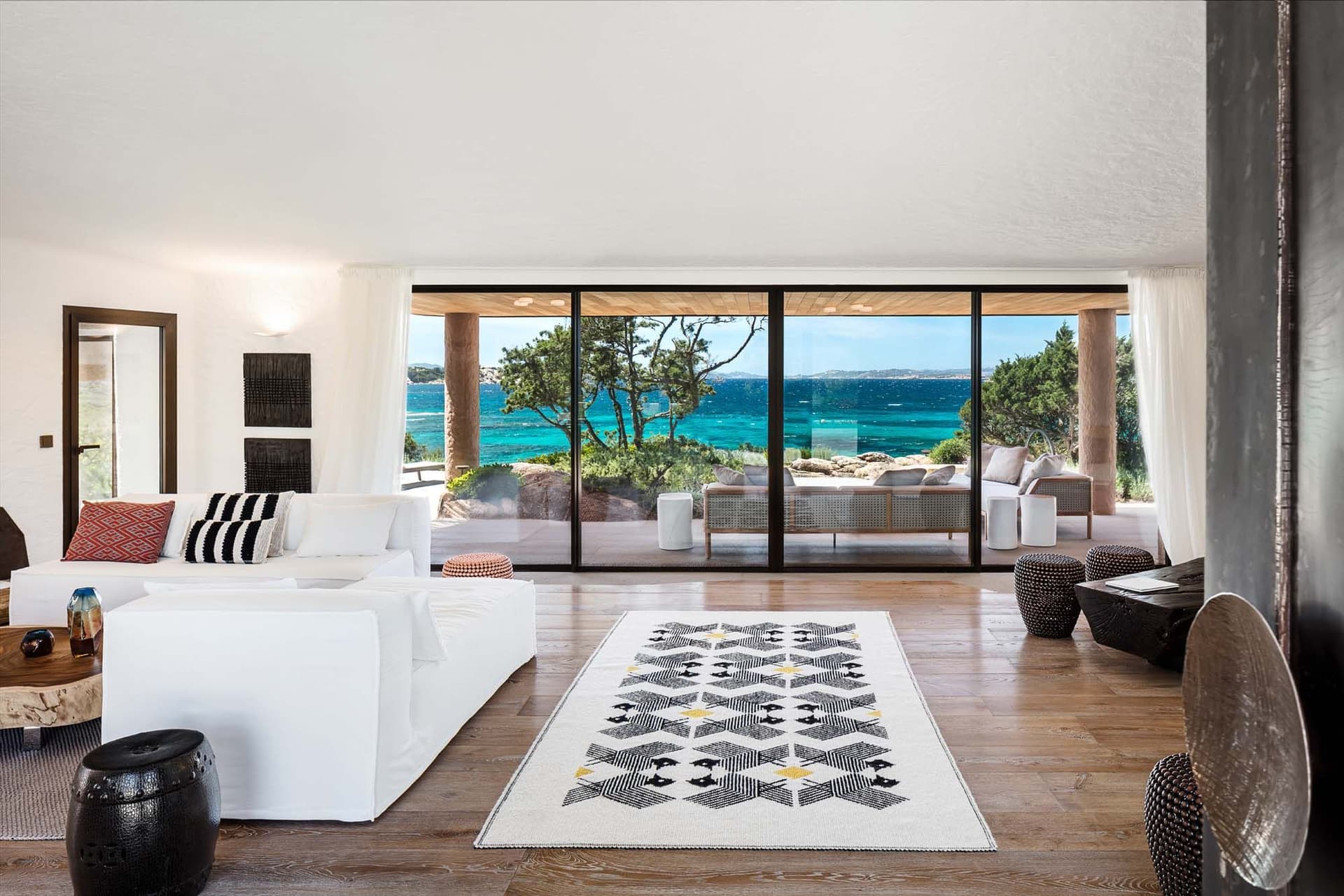The living area of the Costa Smeralda with large windows and sea view.