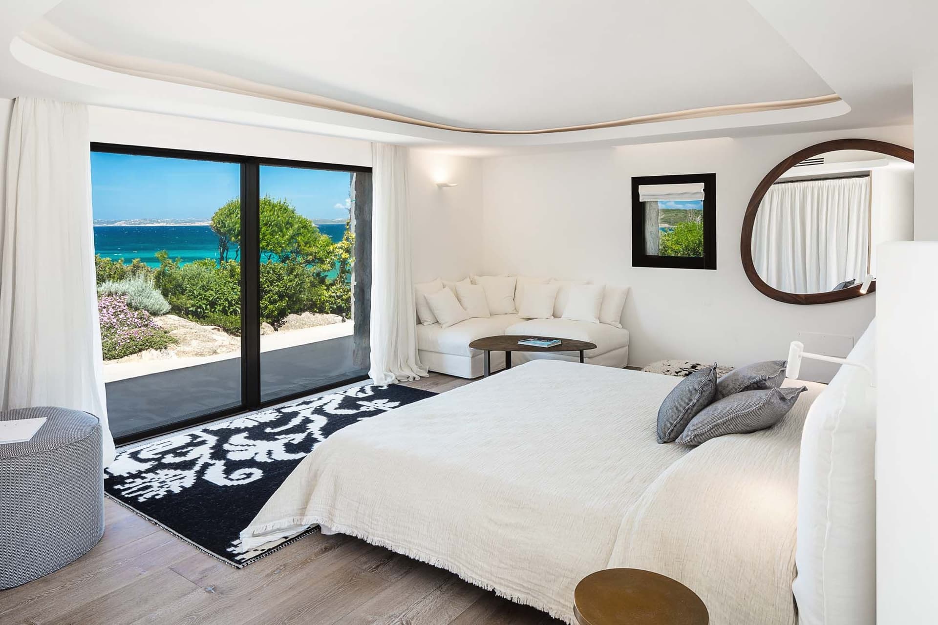 The bedroom of the Costa Smeralda with a sea view.