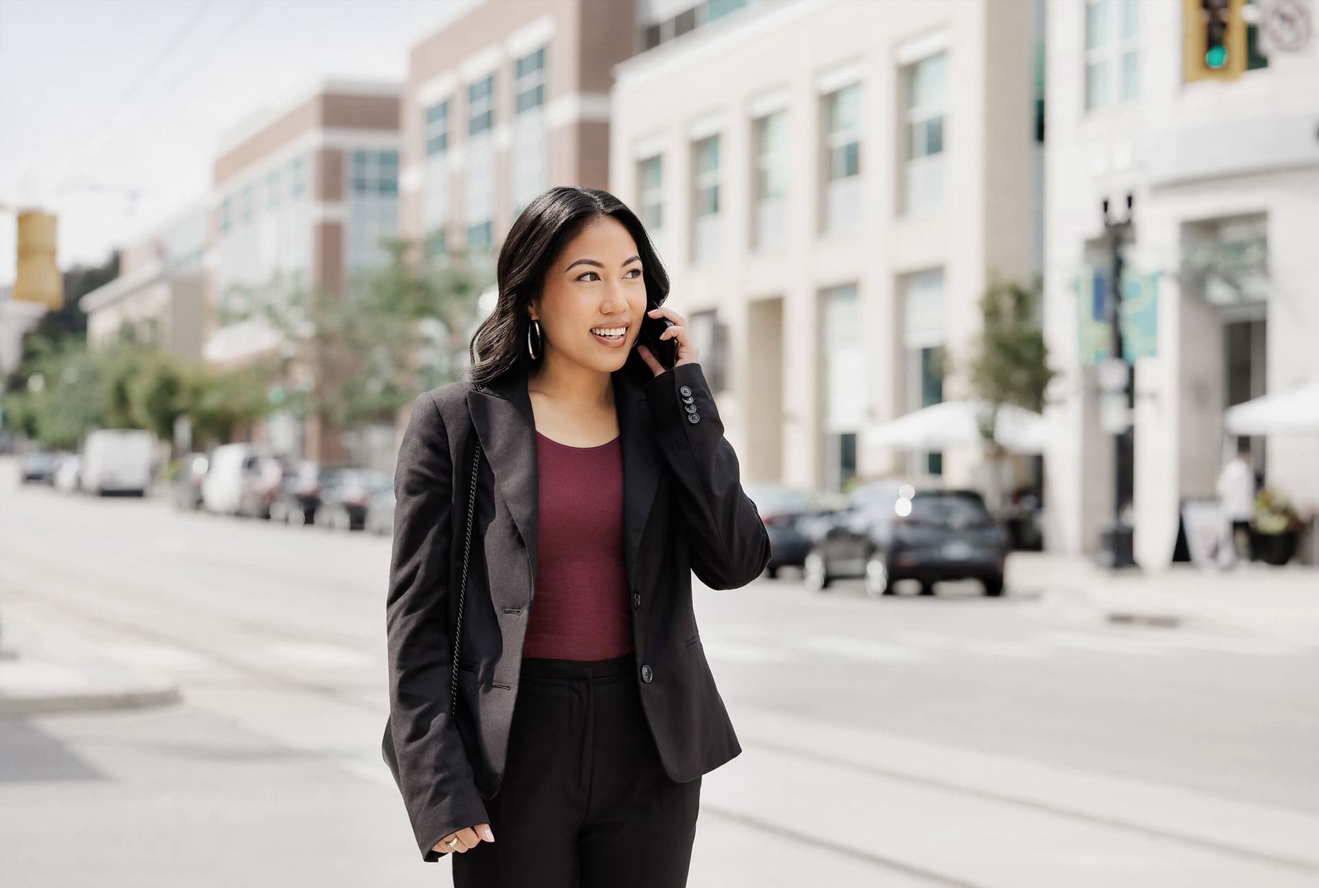 A real estate agent talks on the phone with a smartphone