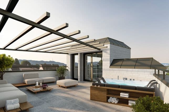 Moderne Dachterrasse mit Pergola, gepolsterten Sitzgelegenheiten, Whirlpool und Pflanzen. Mit Blick auf eine malerische Landschaft mit klarem Himmel und Hügeln.