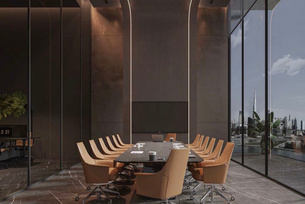 Modern conference room with a long table, sleek tan chairs, and full-height windows showcasing a city skyline view.