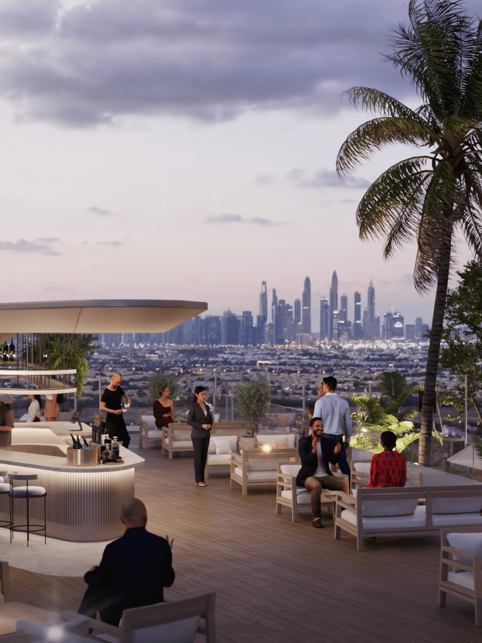 Rooftop lounge at Voxa featuring outdoor seating areas, a central bar pavilion, palm trees, and open views toward the Dubai skyline at sunset.