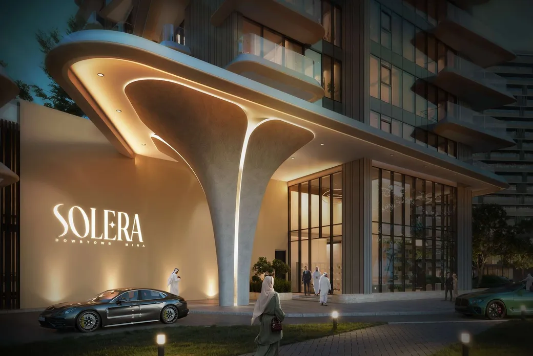 Night view of a modern glass building with a curved, illuminated canopy, warm lighting, a luxury car, and people in traditional dress nearby. KI-generiertes Bild