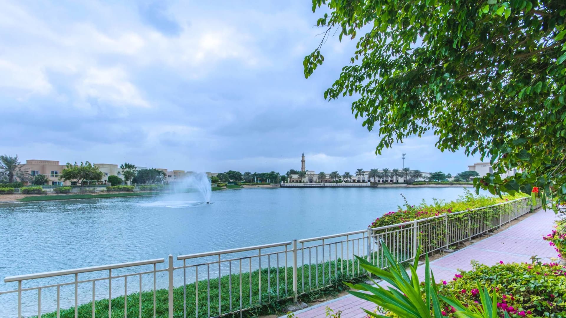 Meadows community lake with surrounding homes