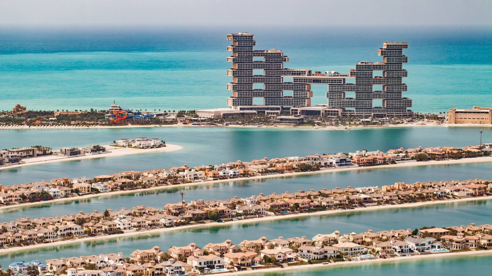 Waterfront villas on the Palm Jumeirah fronds with Royal Atlantis in the background